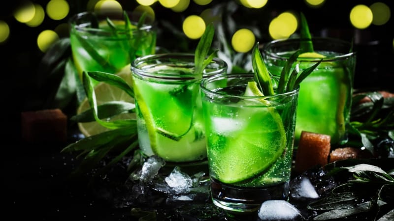Liquid Marijuana Cocktail in shot glasses with lime