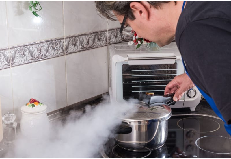 Man checking out a pressure cooker