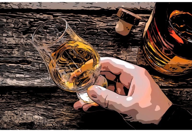 Man holding Glencairn whiskey tasting glass