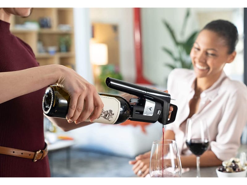 Man pouring wine using Coravin wine preserver