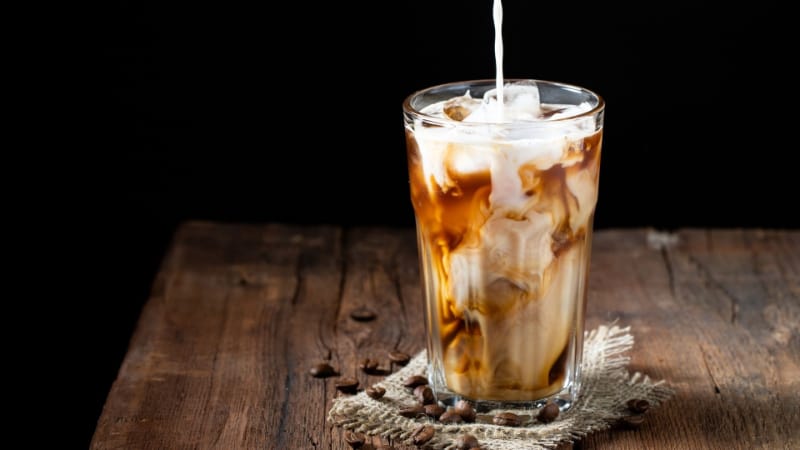 Milk being poured in a Kahlua iced coffee