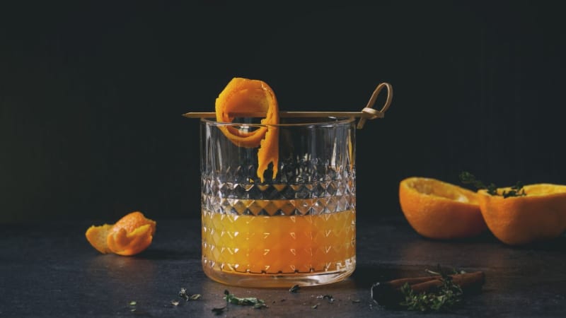 Orange cocktail with orange peels