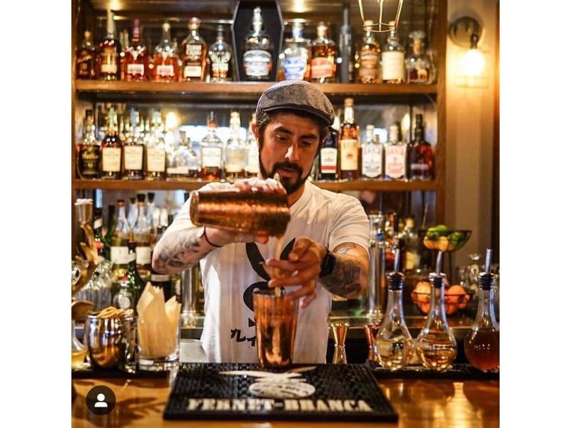 Pedro Barriga pouring liquor from a cocktail shaker