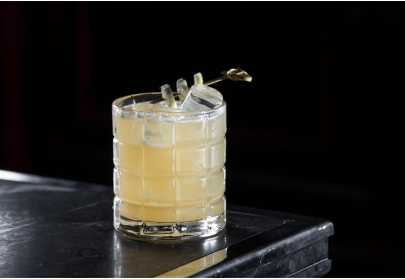 Penicillin cocktail on a bar desk in black background