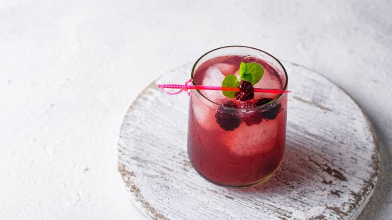 Purple Glitter Cocktail  with raspberries