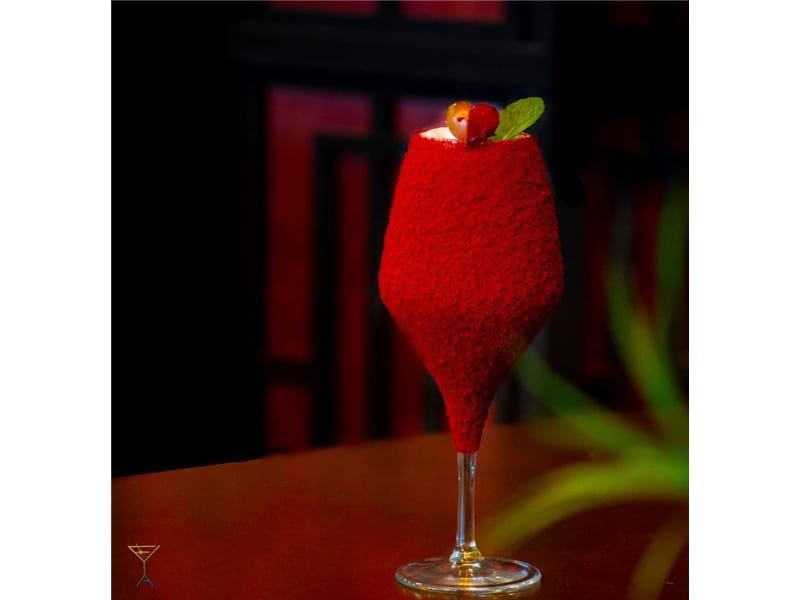 Red velvet cocktail in a tulip glass