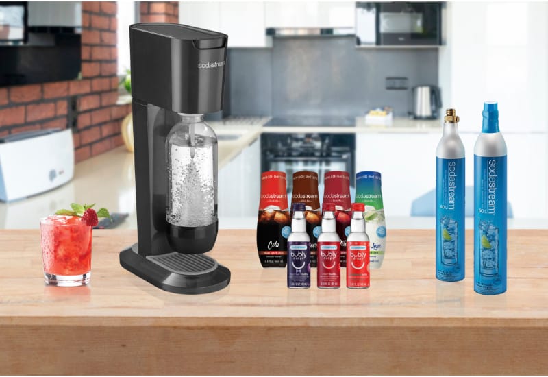 SodaStream Machines, a glass, and syrups and Co2 Tank