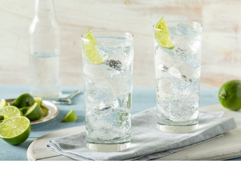 Sparkling water with lime on top of a table