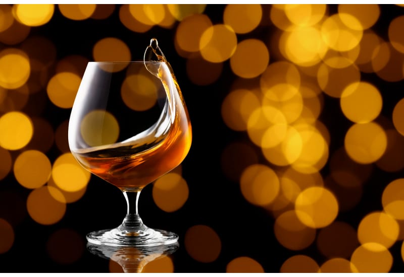 Splash of brandy in snifter glass