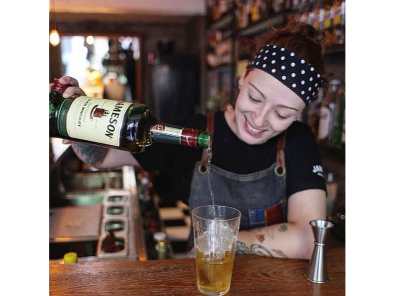  Stephanie Marinkovic pouring wine into a glass 