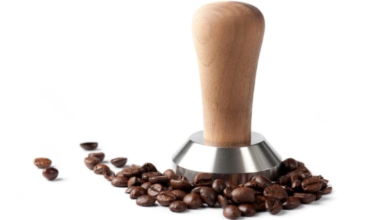 Tamper with coffee granules