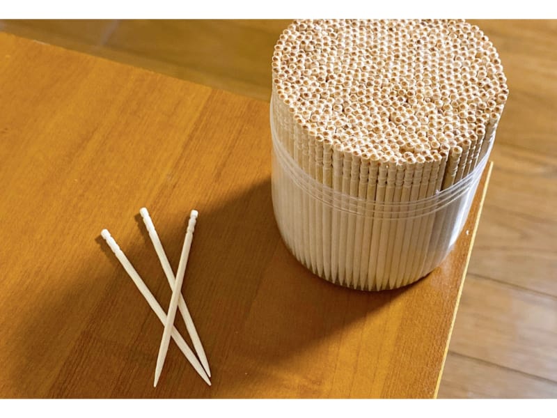 Toothpicks in a plastic container