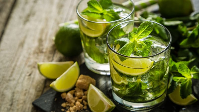Two glasses of mojito with lime and mint
