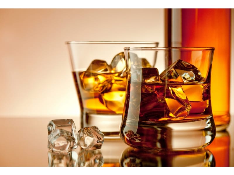 Whiskey and bourbon glasses with ice