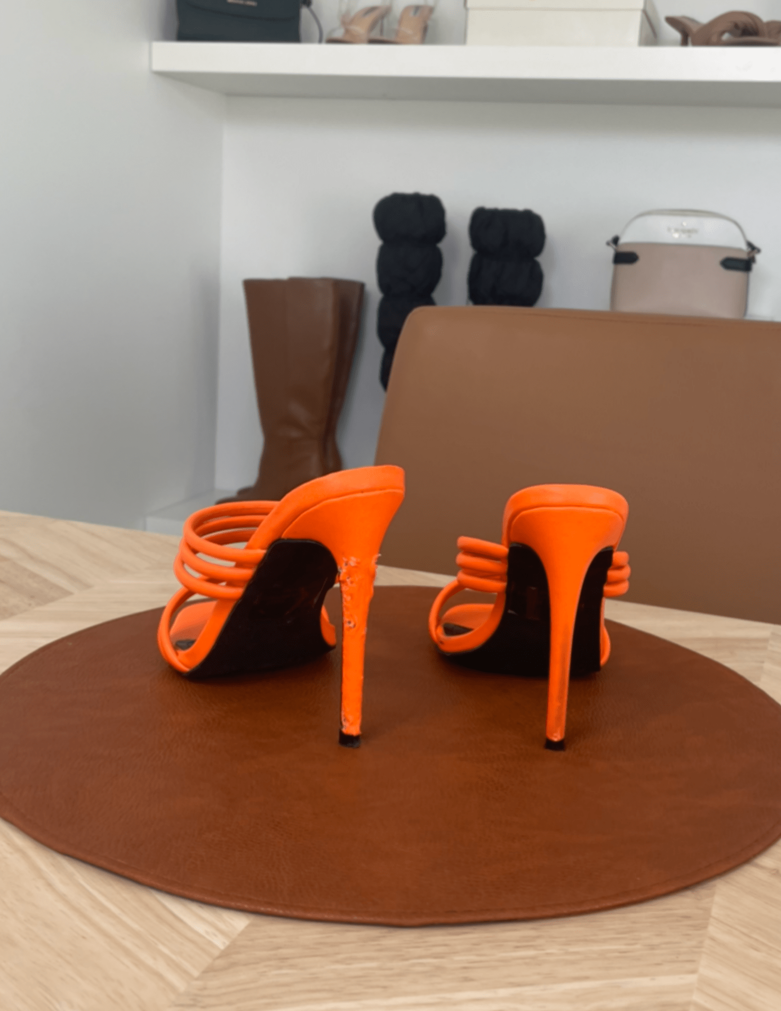 back of the orange chewed stiletto heel 