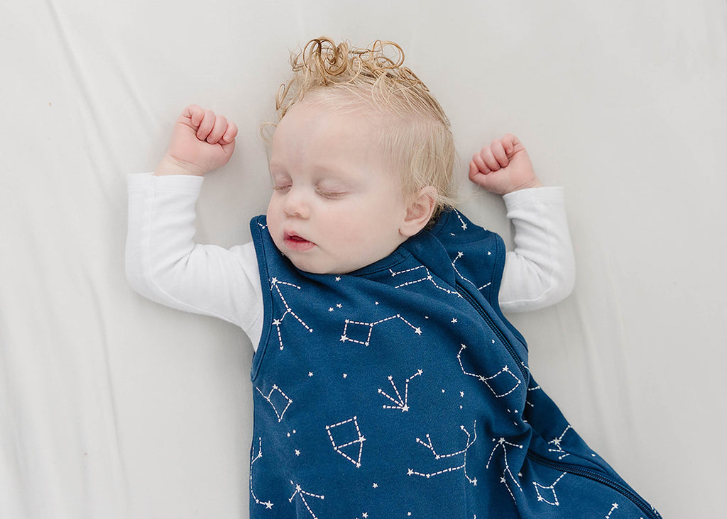 Baby sleeping comfortably in a Woolino 4 Season sleep sack, From Swaddles to Snuggles_How to Keep Your Baby Warm at Night, Ensure warmth and comfort all night long