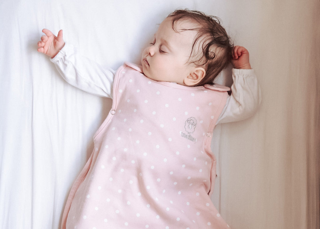 Baby sleeping in a Woolino 4 Season® Ultimate Baby Sleep Bag