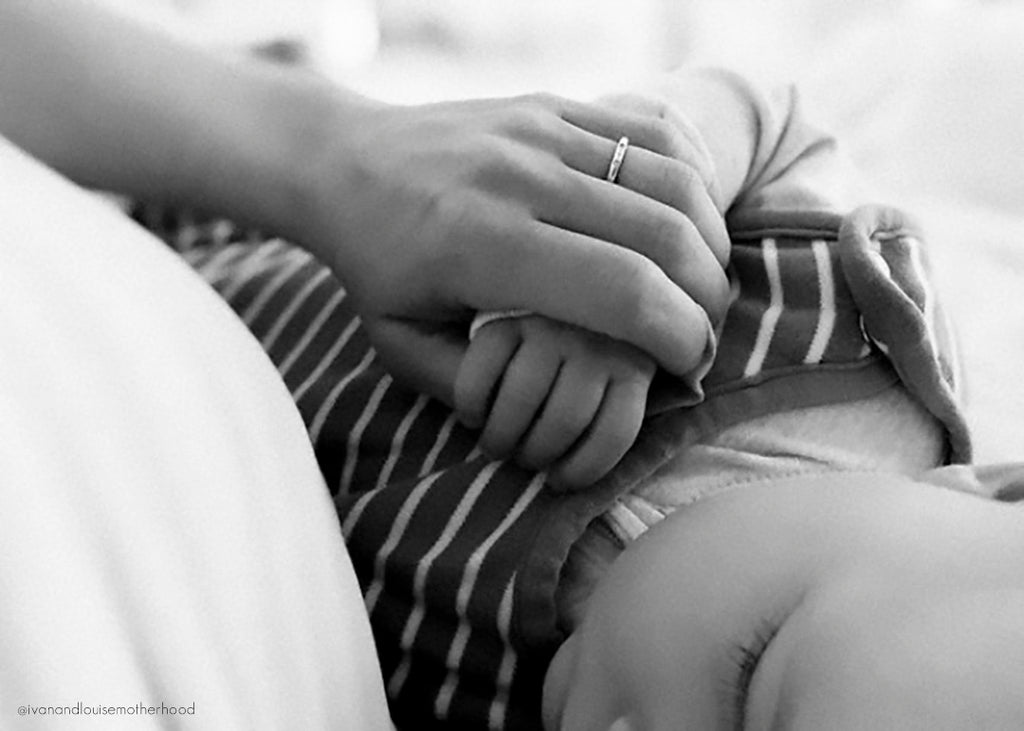 Everything You Need to Know About Postpartum Depression (PPD) blog image of mother hand holding baby's hand