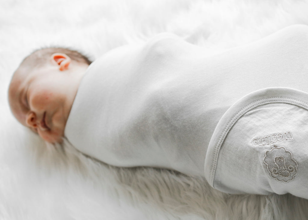 Here's Why Your Newborn Is Grunting & Squirming While Sleeping, Woolino, swaddle, swaddle blanket, merino, merino wool, baby noises, sleeping noises, baby, sleeping baby.