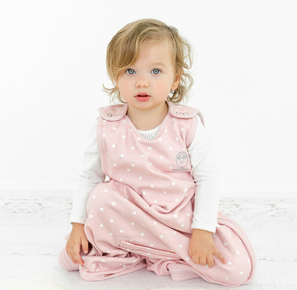 Toddler wearing a Woolino 4 Season Ultimate Toddler Sleep Sack.