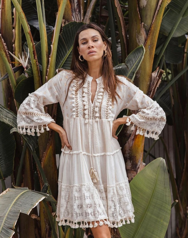 woman wearing a white boho dress