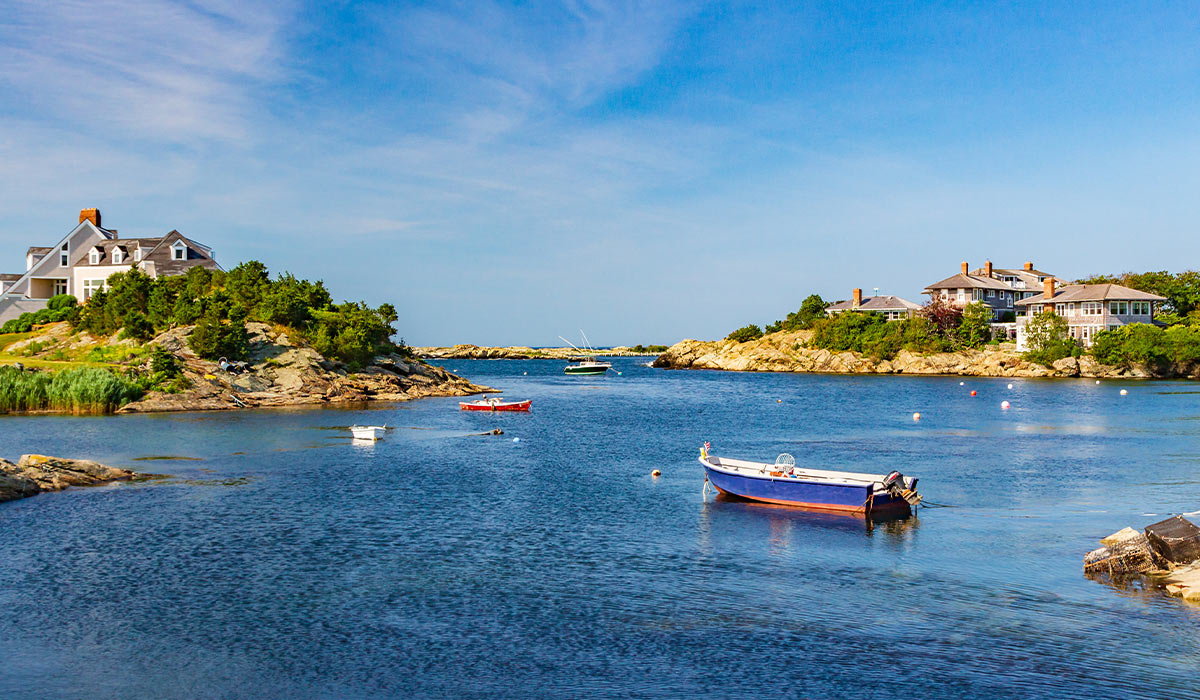 Bay with boats and houses in distance