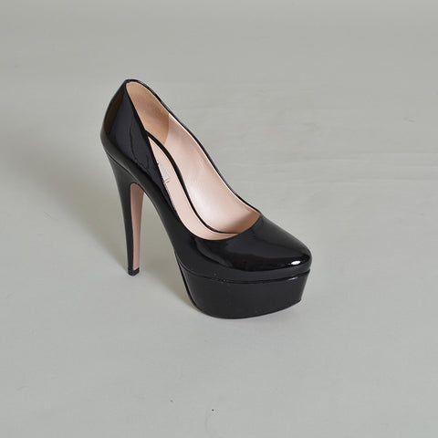 black patent leather platform pumps