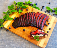 Copper River Blueberry Gravlax    Our Copper River Blueberry Gravlax is hand cured in small batches.  It's beautiful presentation makes it perfect for entertaining or gifting.