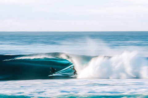 Leroy Bellet photographing a surfer in a barrel