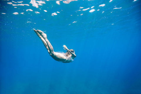 woman diving underwater