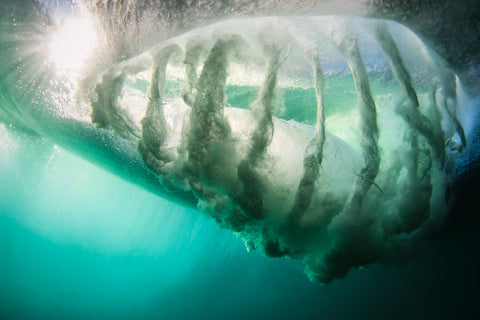 Barrel of a wave shot from underneath by Phil Thurston