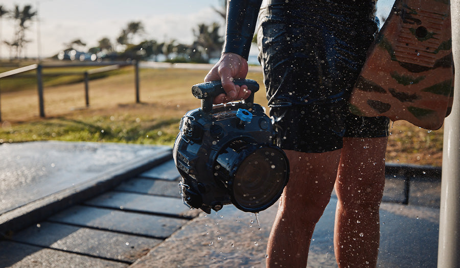 photographer carrying camera water housing for Nikon Z9