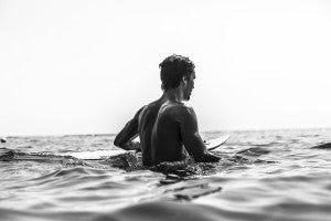 Art Brewer paddling out