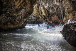 picture of waves crashing into cave 