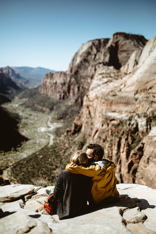 couple climbing mountains together