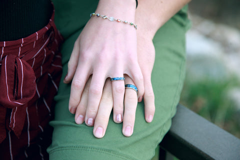 couple wearing promise rings