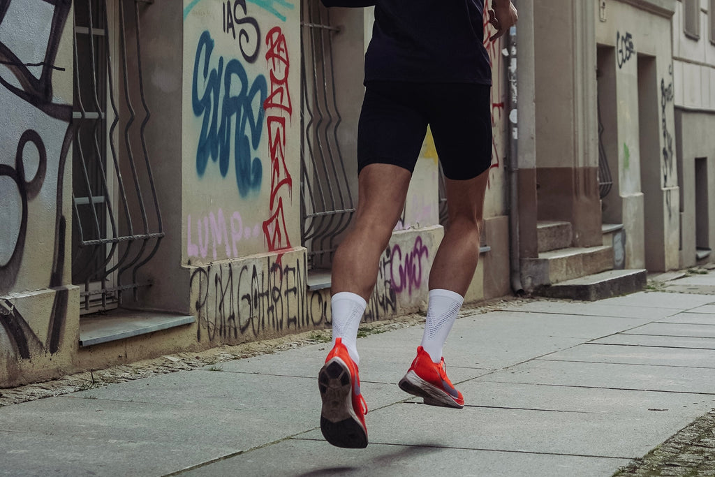 Man in black shorts jogging.