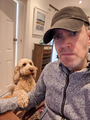 Writer Andrew Dickens and his dog Brewster.