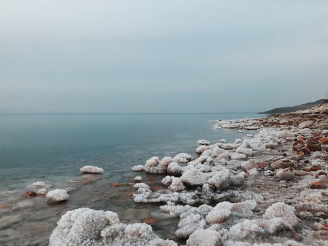 Crystalline salt formations on a seashore under the sky