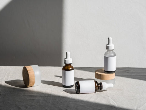 white and brown bottles on white table