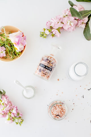 set of jars of bath salts blends composed with aromatic oils and natural flowers