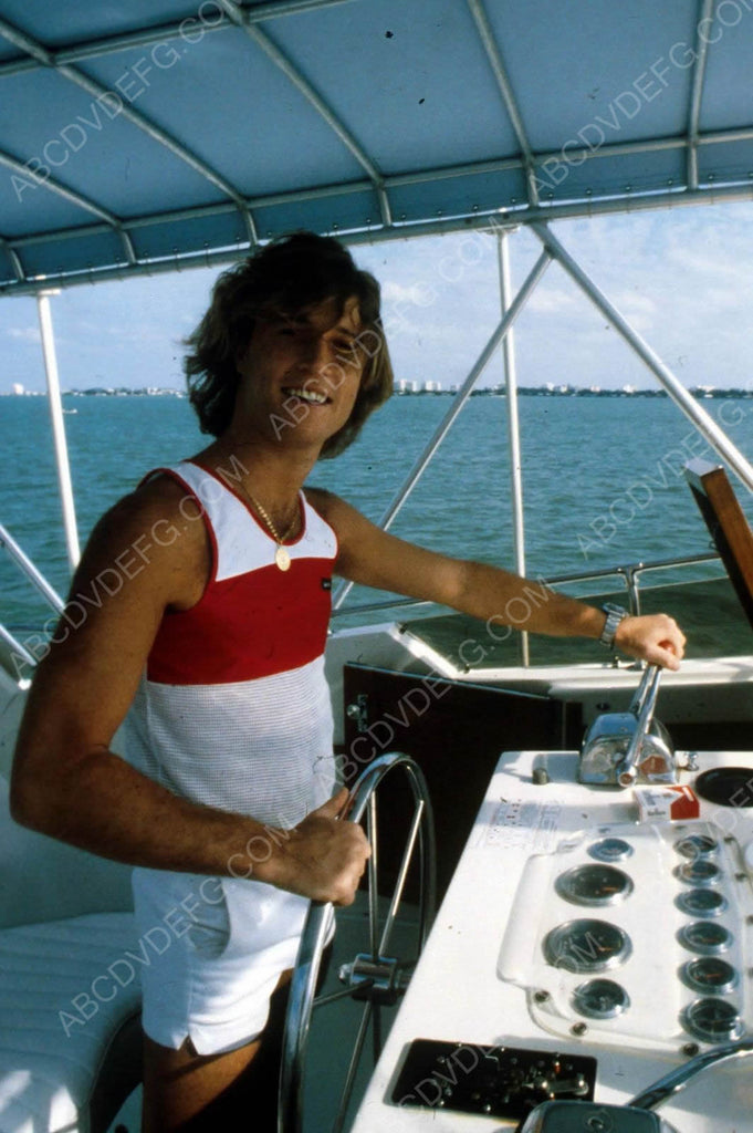 captain Andy Gibb at the boat controls 8b20-6564 – ABCDVDVIDEO