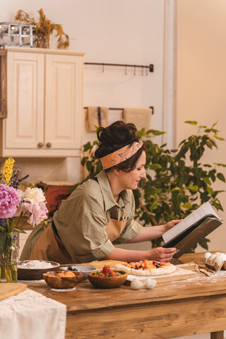 woman reading cookbook