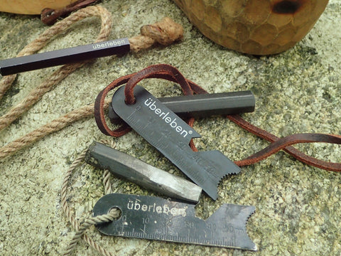 The Überleben Hexa 3-inch fire starter, one old and one new, are displayed. These durable and high-quality fire starters are perfect for your next camping or backpacking trip.