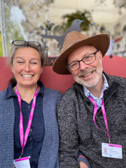 Image of Genny (on the left) and Tony (on the right) smiling at the camera