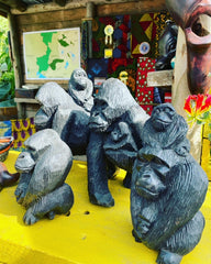 Picture of hand-carved wooden gorillas on the tourist kiosk, part of The Fauna & Flora Garden 