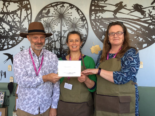 Image of Tony, Genny and Jane holding a certificate on the A Blackbird Sang stand at RHS Chelsea Flower Show 2021