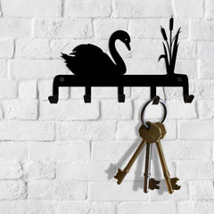 Image of a row of small hooks, decorated above the hooks with a swimming swan