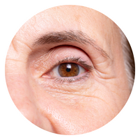 close up of a 60+ aged woman with eyebrow curved around eye