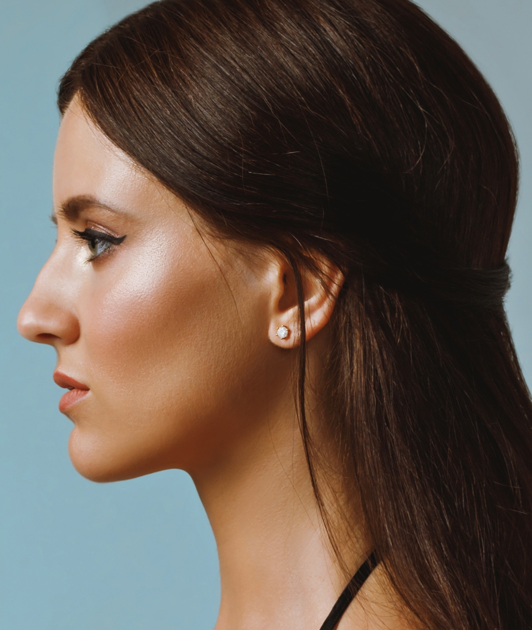 Left Profile View of a 20-something brunette woman